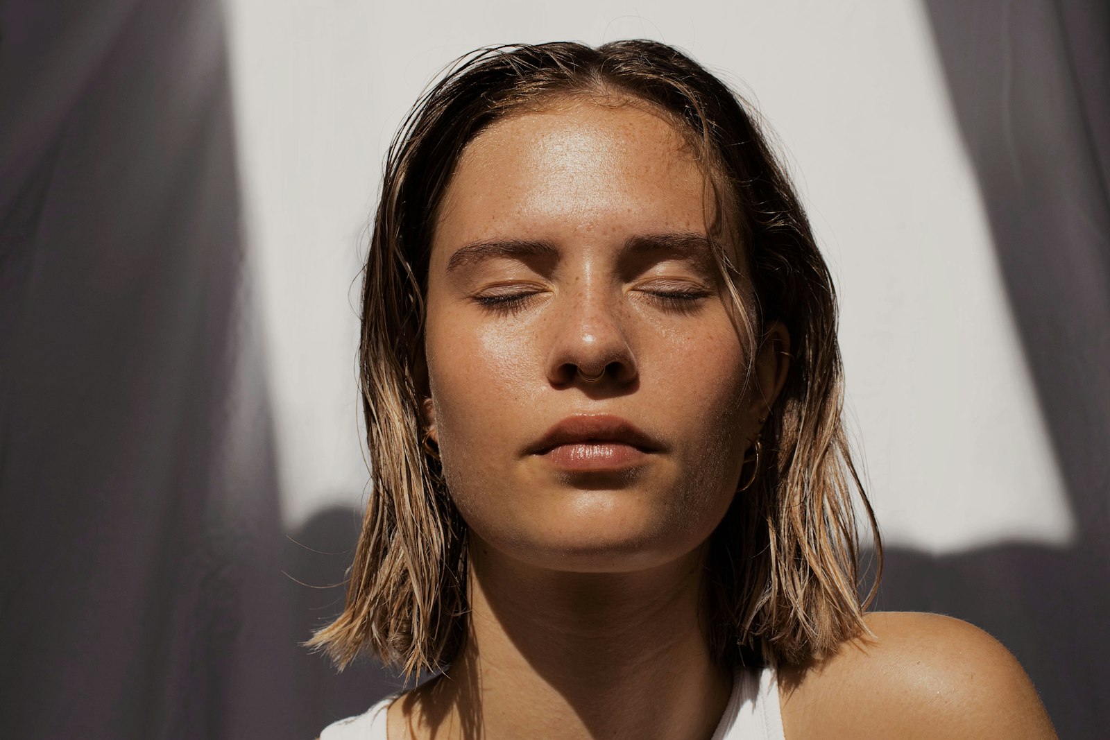 Hands applying skincare products during a gentle routine