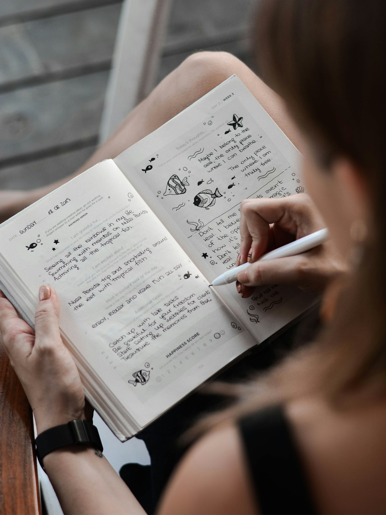 Open journal and pen used to track healthy routines